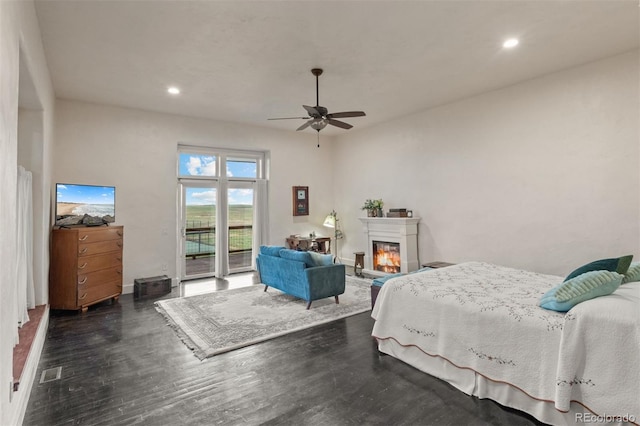 11881 County Road 37, Fort Lupton, CO 80621 - bedroom featuring access to exterior, wood finished floors, recessed lighting, a glass covered fireplace, and a ceiling fan