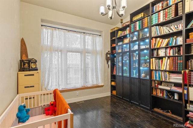 11881 County Road 37, Fort Lupton, CO 80621 - bedroom with a chandelier and wood finished floors