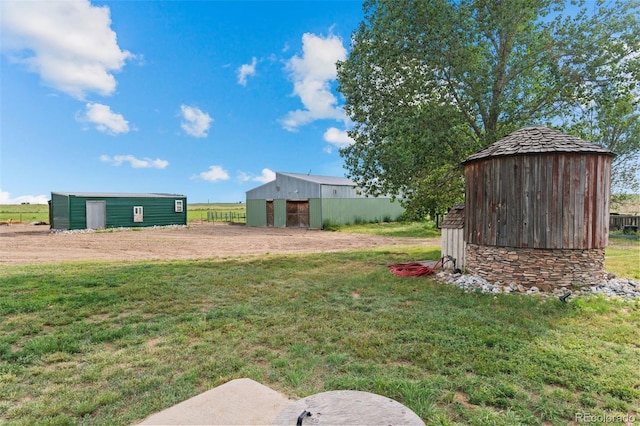11881 County Road 37, Fort Lupton, CO 80621 - view of grassy yard with a pole building and an outbuilding