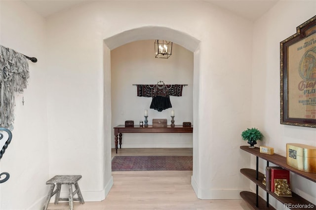 11881 County Road 37, Fort Lupton, CO 80621 - hall with arched walkways and wood finished floors