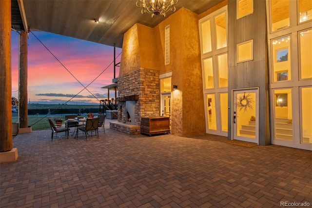 11881 County Road 37, Fort Lupton, CO 80621 - view of patio / terrace with an outdoor stone fireplace and outdoor dining space