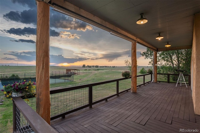 11881 County Road 37, Fort Lupton, CO 80621 - wooden terrace featuring a view of rural / pastoral area and a lawn
