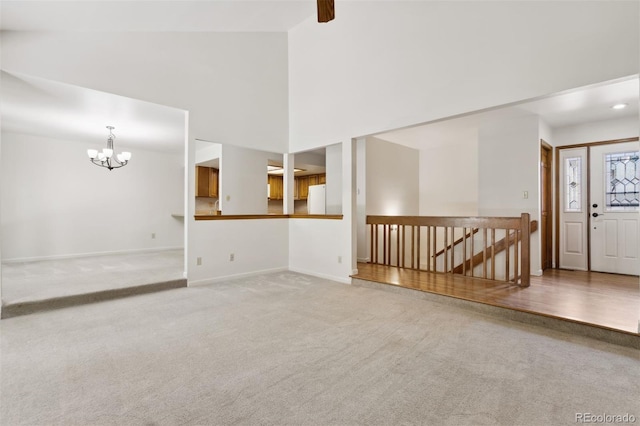 interior space featuring a notable chandelier and carpet floors