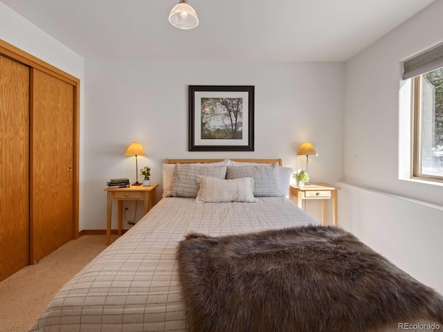 carpeted bedroom featuring a closet