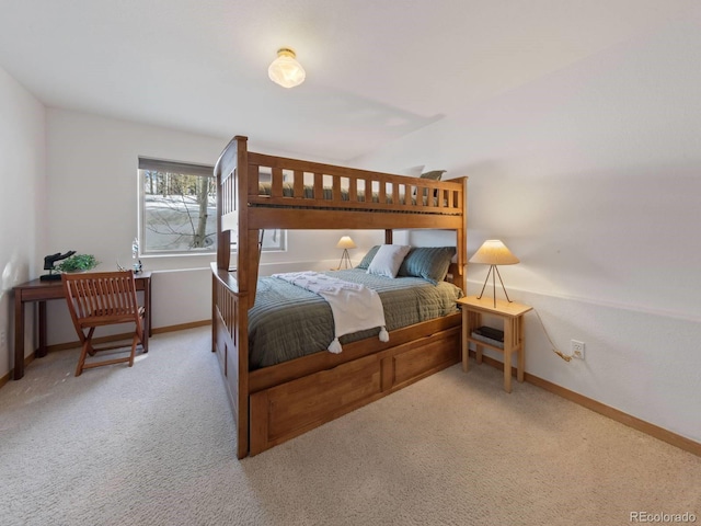 carpeted bedroom featuring baseboards