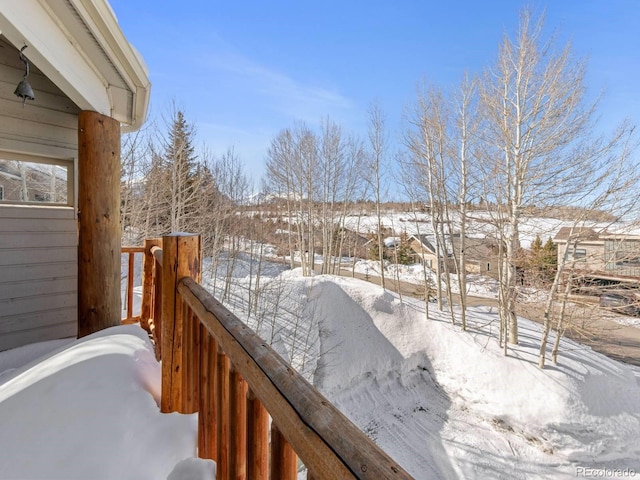 view of snow covered deck