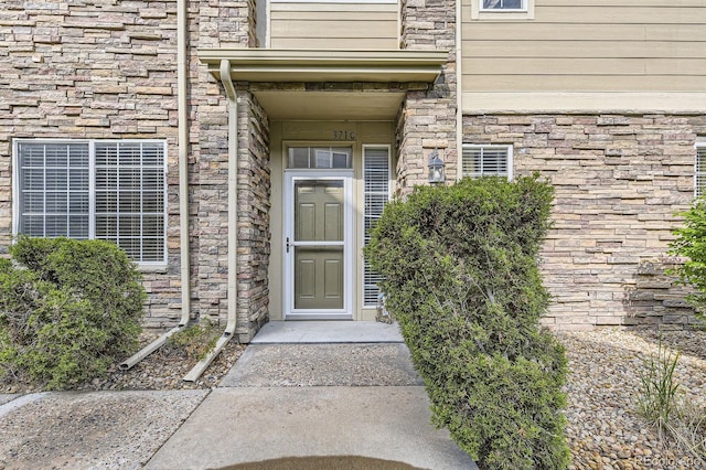 371 Granby Way Unit C, Aurora, CO 80011 - entrance to property featuring stone siding