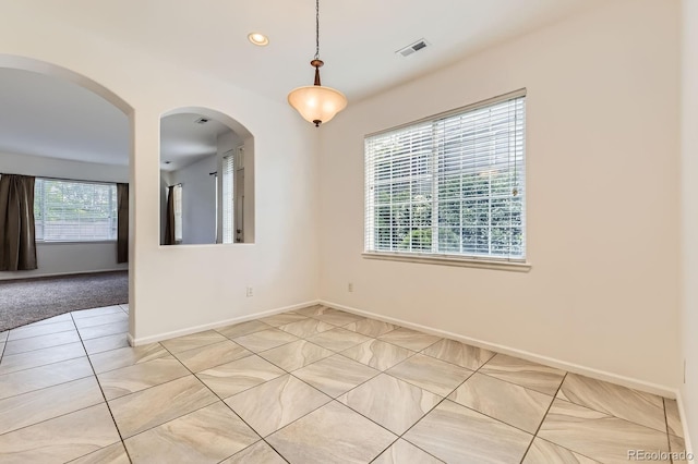 371 Granby Way Unit C, Aurora, CO 80011 - spare room featuring light tile patterned floors, recessed lighting, baseboards, and arched walkways