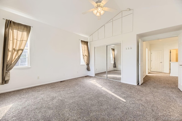 371 Granby Way Unit C, Aurora, CO 80011 - unfurnished bedroom featuring carpet floors, high vaulted ceiling, a closet, baseboards, and ceiling fan