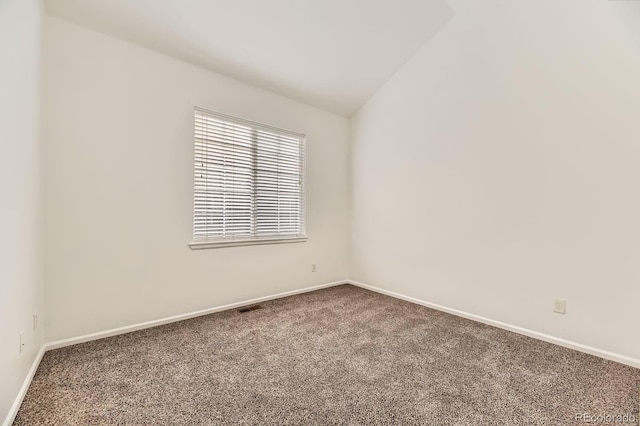 371 Granby Way Unit C, Aurora, CO 80011 - carpeted spare room with baseboards and vaulted ceiling