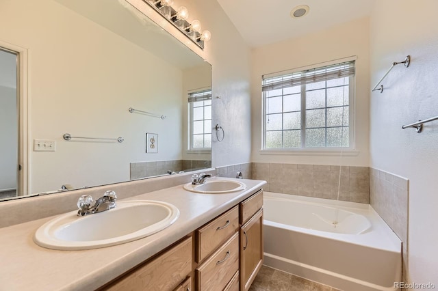 371 Granby Way Unit C, Aurora, CO 80011 - bathroom featuring a bath, double vanity, and tile patterned flooring