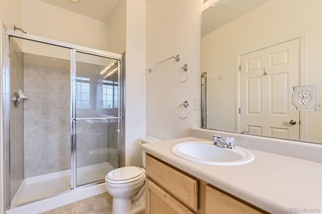 371 Granby Way Unit C, Aurora, CO 80011 - bathroom with a stall shower, vanity, and toilet