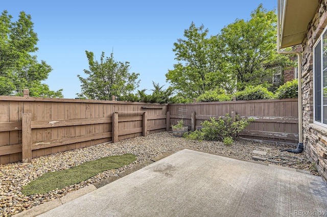 371 Granby Way Unit C, Aurora, CO 80011 - fenced backyard featuring a patio