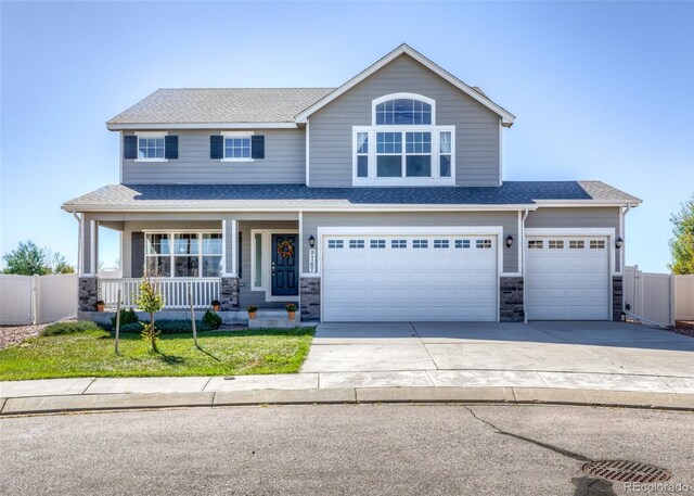 view of front of house with a garage and covered porch