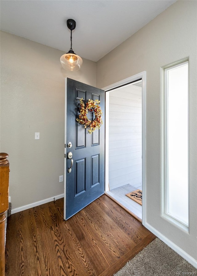 entryway with dark wood-type flooring