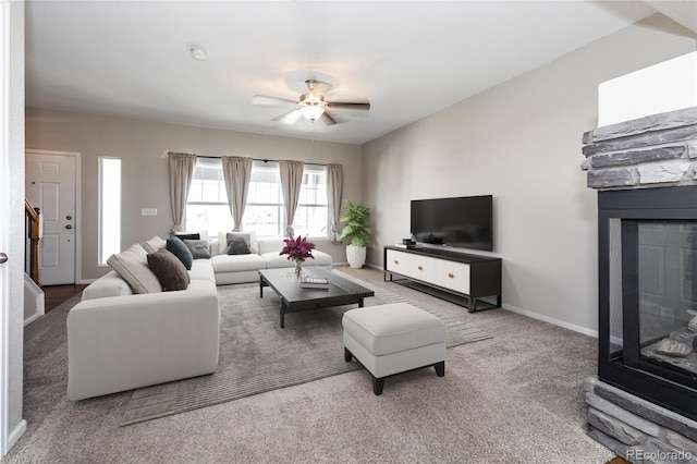 living room with ceiling fan and carpet floors