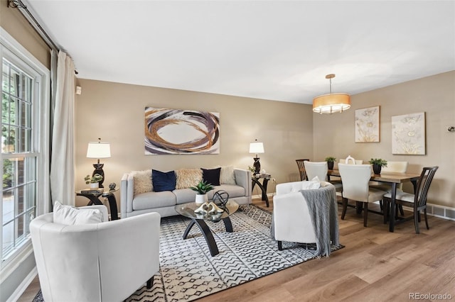 9306 Garrison Dr, Broomfield, CO 80021 - living room with light wood-style flooring and baseboards