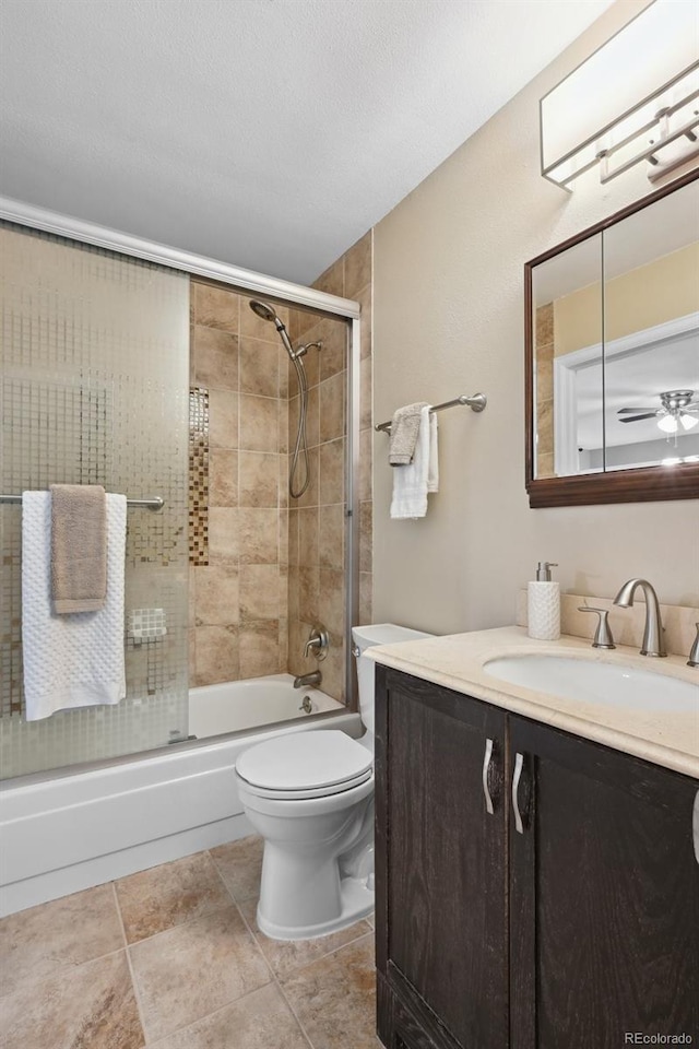 9306 Garrison Dr, Broomfield, CO 80021 - bathroom with vanity, enclosed tub / shower combo, and toilet