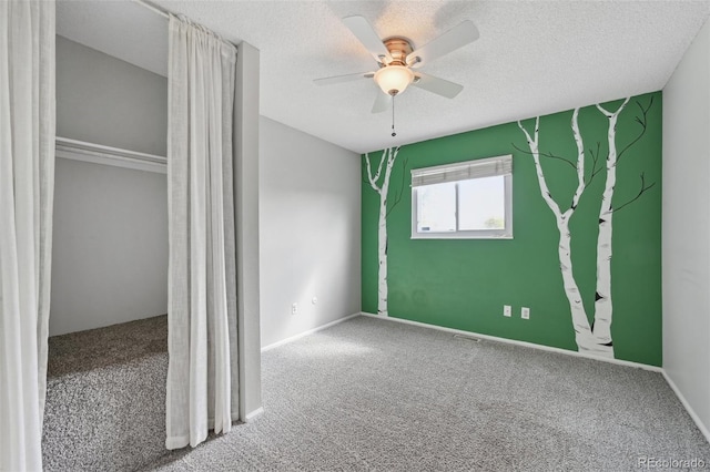 9306 Garrison Dr, Broomfield, CO 80021 - unfurnished bedroom with carpet floors, ceiling fan, and a textured ceiling