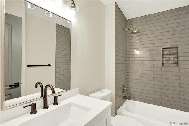 bathroom with shower / bathing tub combination, vanity, and toilet