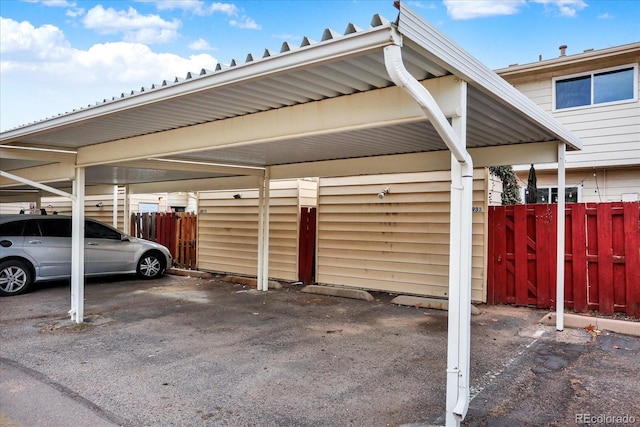 covered parking lot with fence