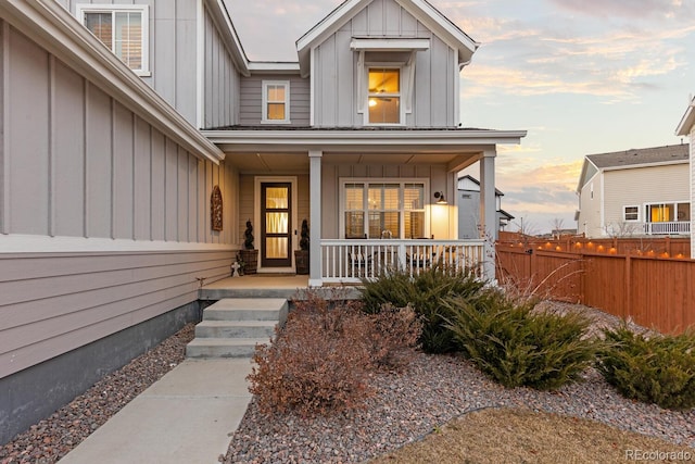 exterior entry at dusk with a porch