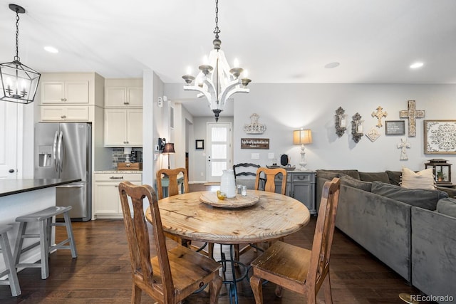 dining room with a notable chandelier and dark wood-type flooring