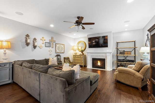 living room featuring dark hardwood / wood-style floors and ceiling fan