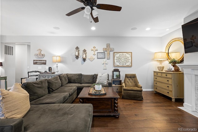 living room featuring dark hardwood / wood-style floors and ceiling fan