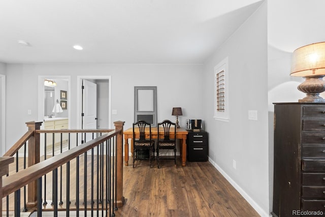 office with dark hardwood / wood-style flooring