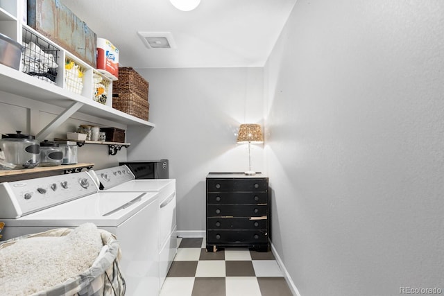 laundry area featuring washing machine and clothes dryer