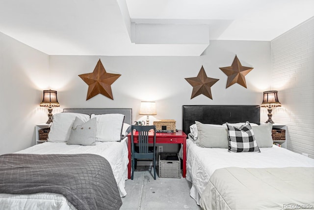 bedroom featuring concrete flooring