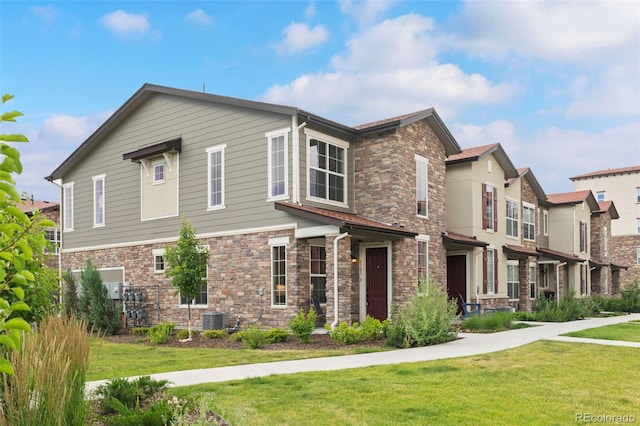 8387 Donati Ter Unit A, Littleton, CO 80129 - view of front of house featuring stone siding and a front yard