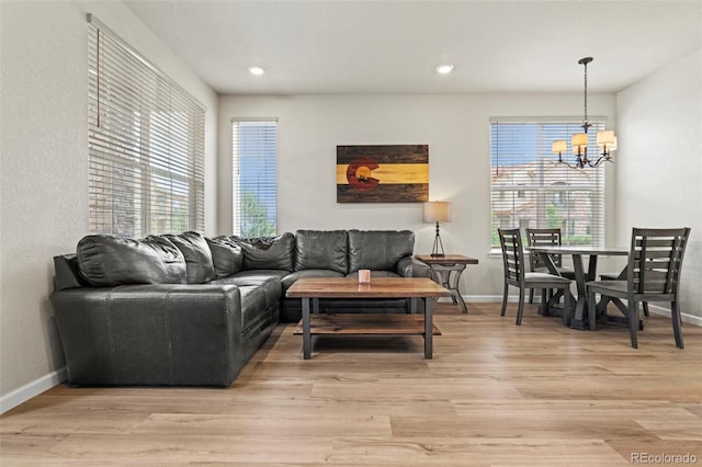 8387 Donati Ter Unit A, Littleton, CO 80129 - living area featuring a chandelier, light wood-style flooring, plenty of natural light, and recessed lighting