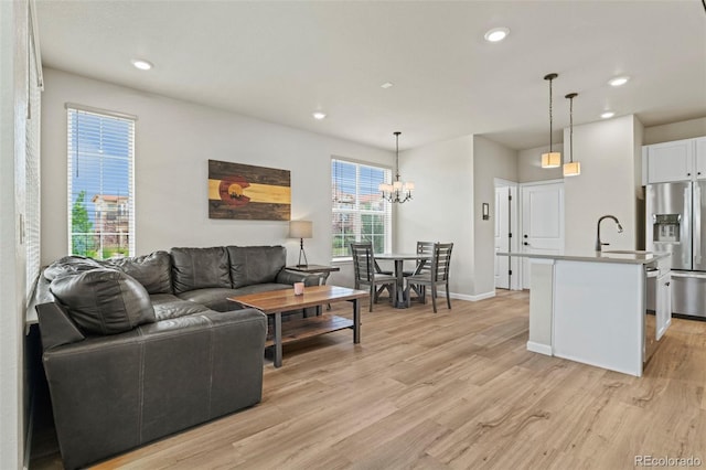 8387 Donati Ter Unit A, Littleton, CO 80129 - living area with recessed lighting, light wood-type flooring, and a chandelier