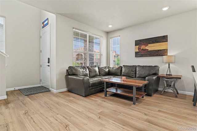 8387 Donati Ter Unit A, Littleton, CO 80129 - living area with light wood finished floors and recessed lighting