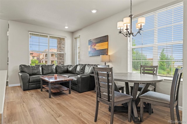 8387 Donati Ter Unit A, Littleton, CO 80129 - living room featuring a chandelier, light wood finished floors, and recessed lighting