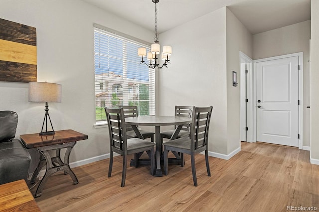 8387 Donati Ter Unit A, Littleton, CO 80129 - dining space with a chandelier and light wood finished floors