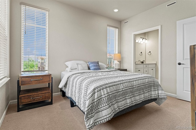 8387 Donati Ter Unit A, Littleton, CO 80129 - bedroom with carpet flooring, multiple windows, ensuite bath, and recessed lighting
