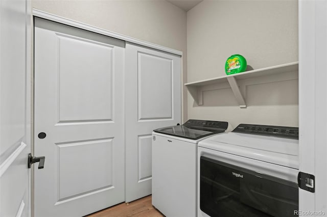 8387 Donati Ter Unit A, Littleton, CO 80129 - washroom featuring independent washer and dryer and light wood finished floors