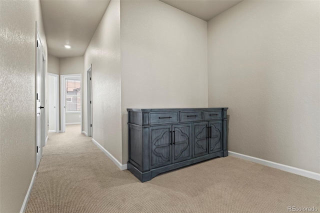 8387 Donati Ter Unit A, Littleton, CO 80129 - hallway with light colored carpet and baseboards