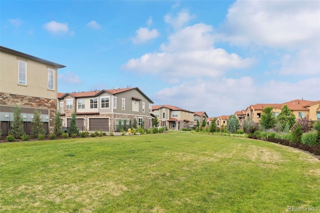 8387 Donati Ter Unit A, Littleton, CO 80129 - view of green lawn with a residential view and an attached garage