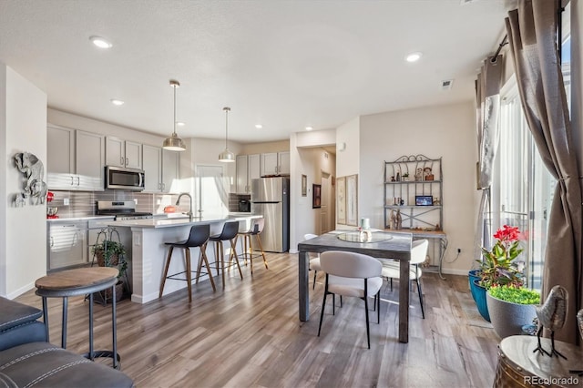 dining space featuring hardwood / wood-style flooring