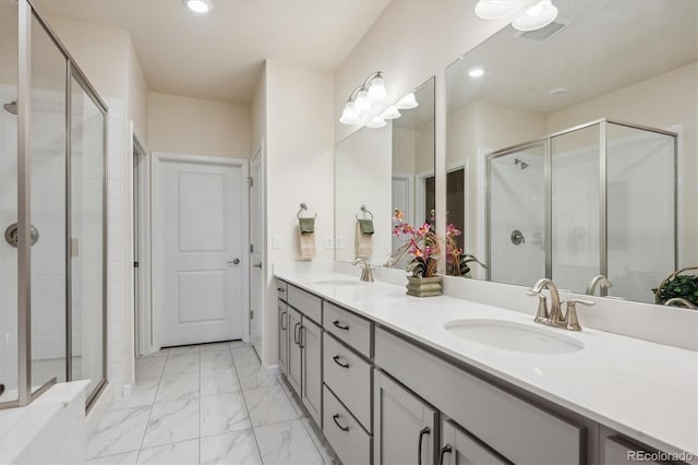 bathroom with vanity and a shower with shower door