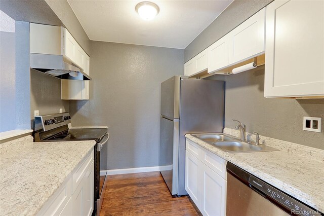 14204 E 1st Dr Unit A12, Aurora, CO 80011 - kitchen with appliances with stainless steel finishes, extractor fan, white cabinets, a textured wall, and dark wood-type flooring
