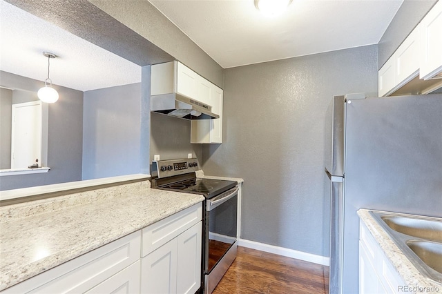 14204 E 1st Dr Unit A12, Aurora, CO 80011 - kitchen featuring appliances with stainless steel finishes, range hood, dark wood-type flooring, white cabinetry, and pendant lighting
