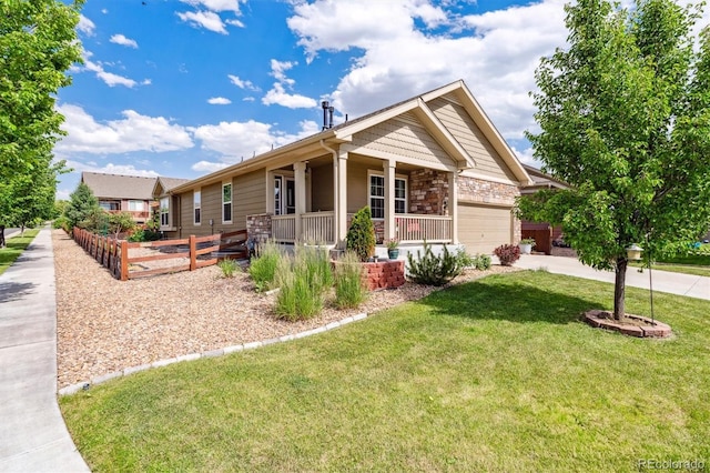 10288 Olathe Way, Commerce City, CO 80022 - view of front of house with covered porch, an attached garage, driveway, and stone siding