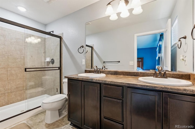 10288 Olathe Way, Commerce City, CO 80022 - bathroom with a shower stall, double vanity, and tile patterned floors