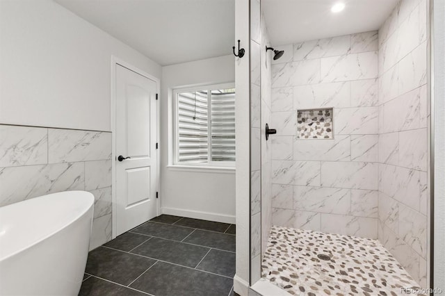 10288 Olathe Way, Commerce City, CO 80022 - full bathroom featuring a freestanding bath, a stall shower, and tile patterned floors