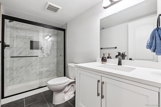 10288 Olathe Way, Commerce City, CO 80022 - full bathroom with vanity, a shower stall, a textured wall, and tile patterned flooring